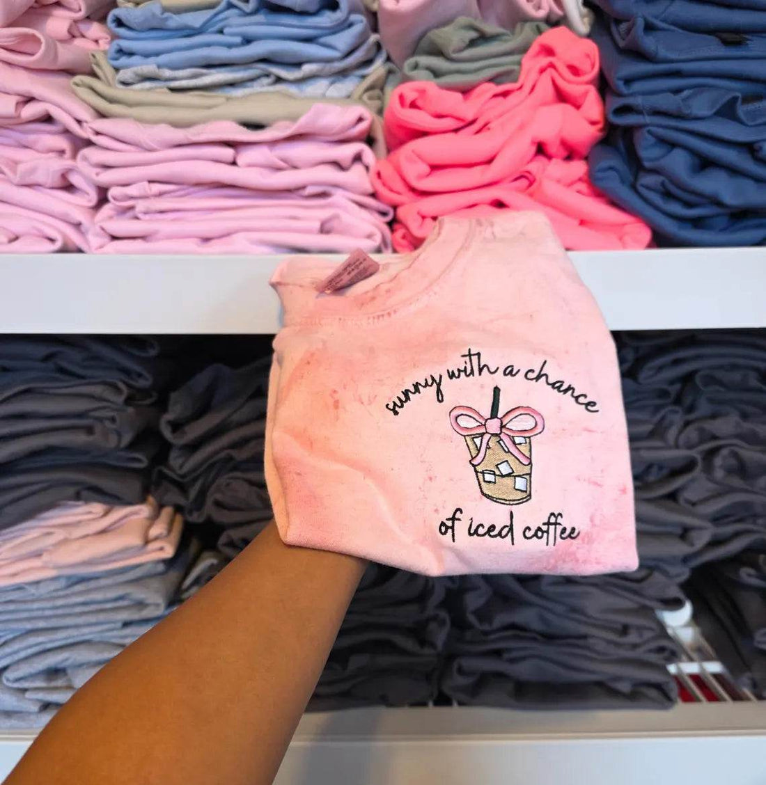 Two pink and beige towels with coffee-themed designs and text on a light background.but-first-coffee-shirt