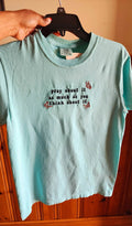A blue t-shirt with the text 'pray about it as much as you think about it' printed on the front. pray-t-shirt