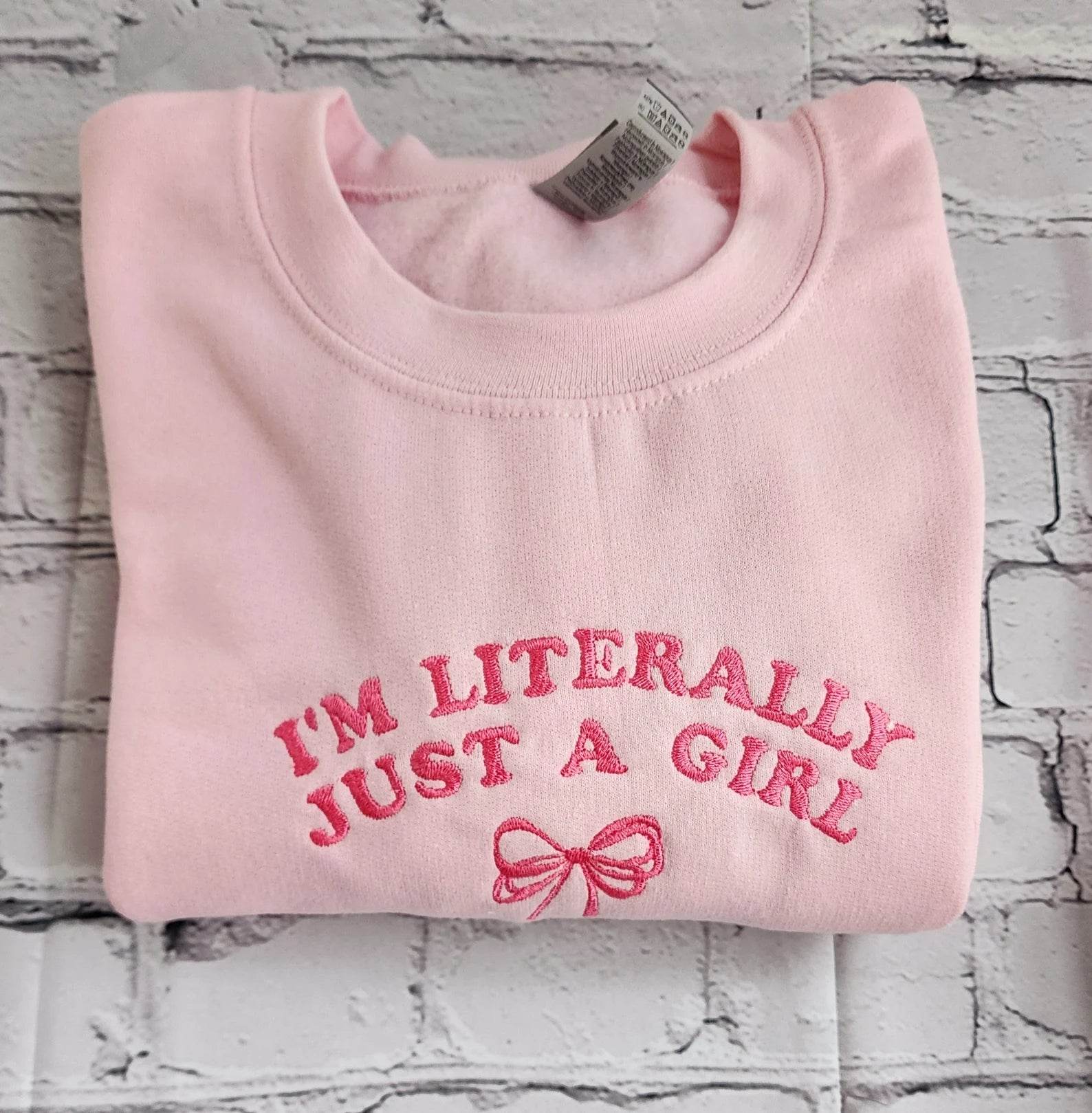 Stylish women’s sweatshirt with embroidered girl quote