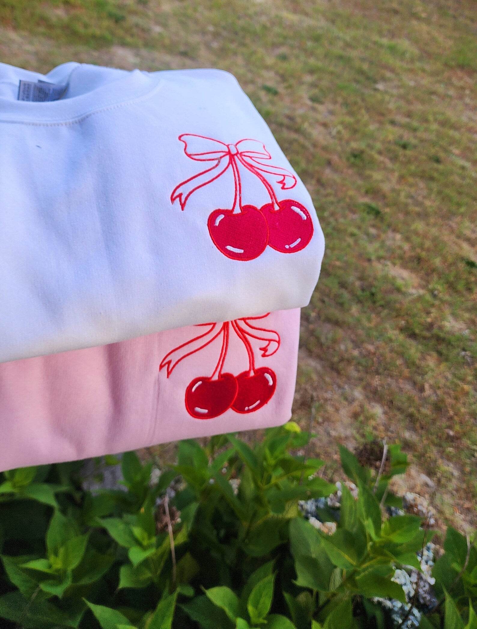 Close-up of Cherry Bow Embroidery on Sweatshirt