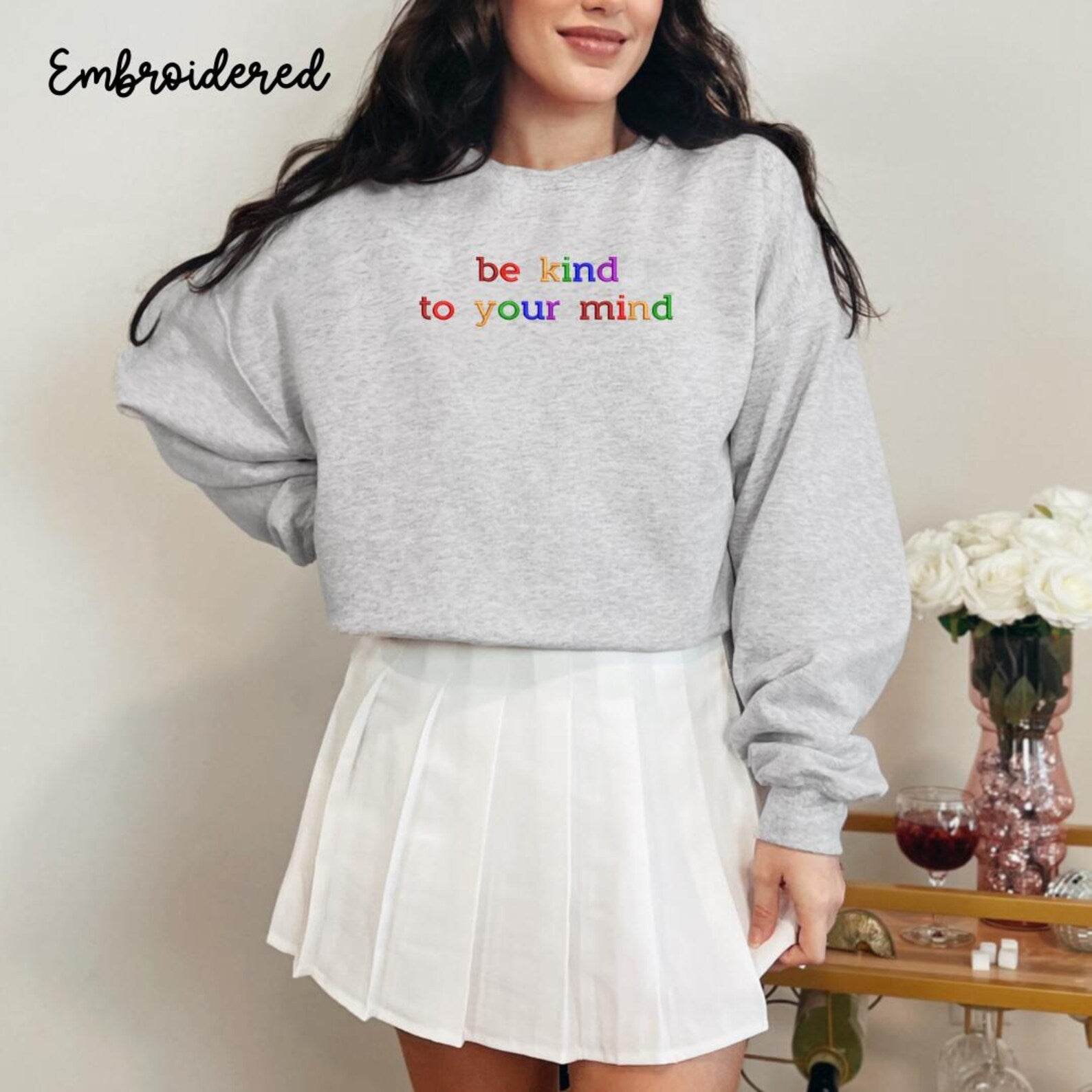 Women’s stylish sweatshirt with “Be Kind to Your Mind” design
