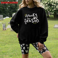 Women’s Halloween sweatshirt with spooky graphic crewneck