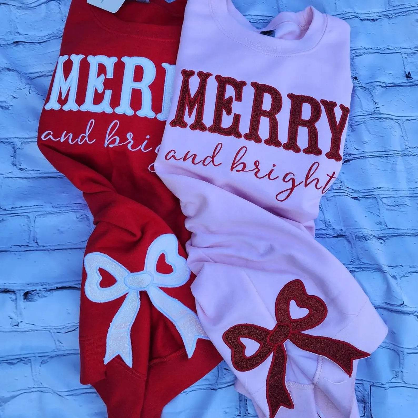 Girl wearing merry and bright bright pink sweatshirt