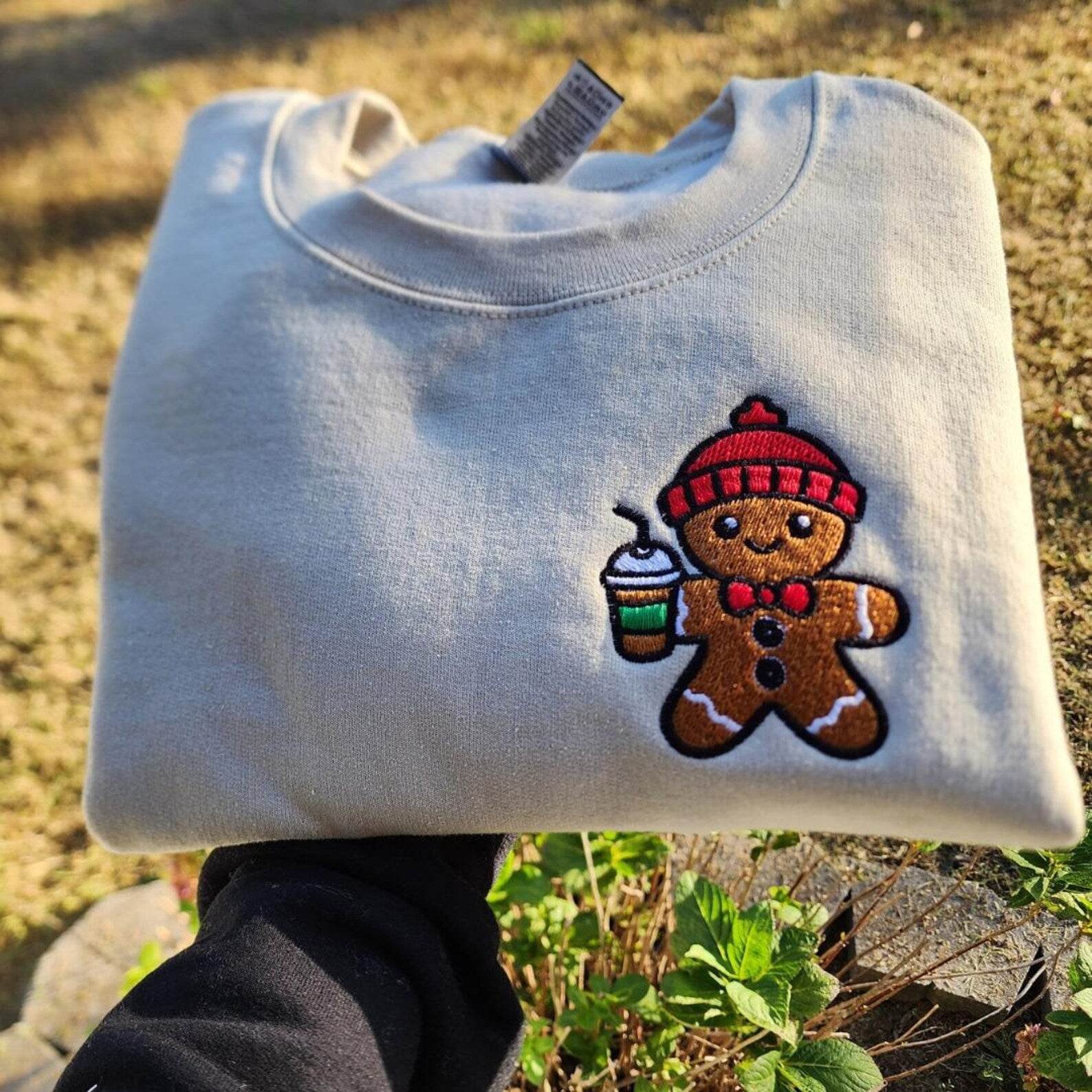 Close-up of gingerbread print on holiday sweatshirt