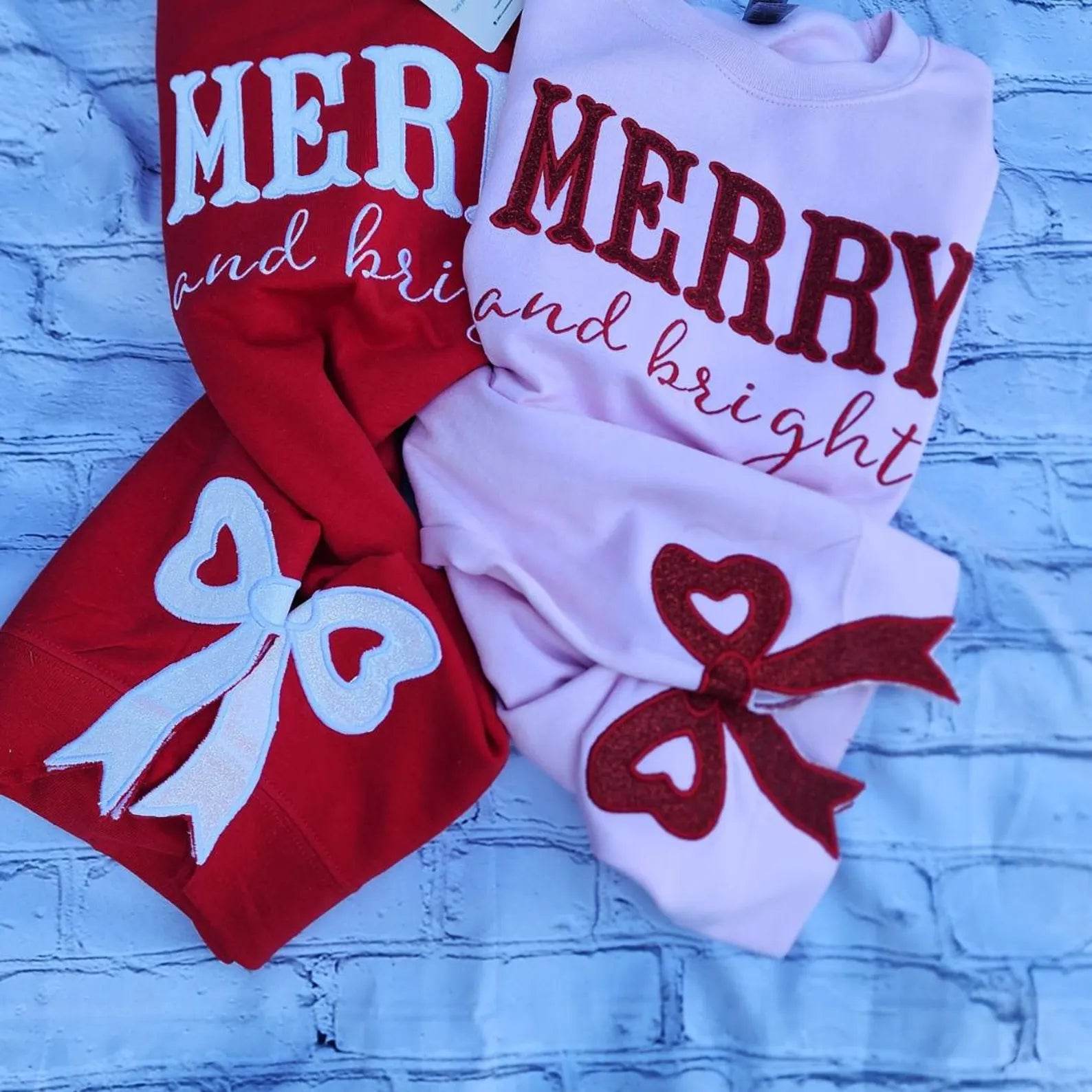 Side view of bright pink merry and bright sweatshirt