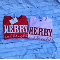 Bright red sweatshirt styled for girls’ holiday celebrations