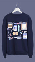 A navy blue sweatshirt with hand-drawn medical doodles including a stethoscope, syringe, band-aids, and a steaming cup of coffee.