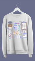a sweatshirt with hand-drawn medical doodles including a stethoscope, syringe, band-aids, and a steaming cup of coffee.
