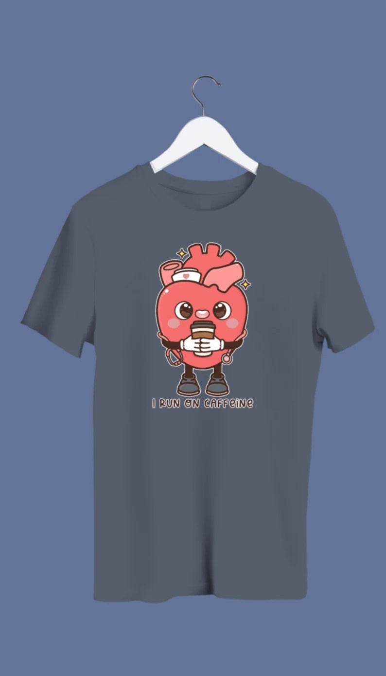 A  crewneck sweatshirt with a graphic of an anatomical heart holding a coffee cup and the phrase 'I live on caffeine.'.