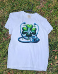 White  Heartbeat Stethoscope T-Shirt, lying on a grassy surface.
