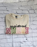 A collection of embroidered crewneck sweatshirts with the word 'NURSE' and 'registered NURSE' embroidered