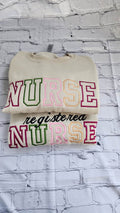 A collection of embroidered crewneck sweatshirts with the word 'NURSE' and 'registered NURSE' embroidered 
