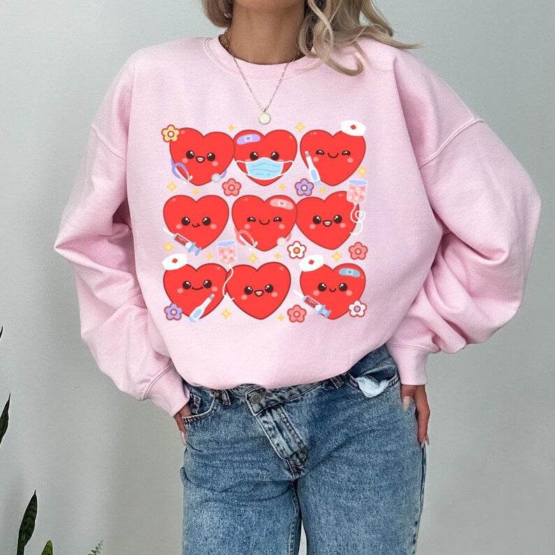 Trendy Nurse Heart Sweatshirt – Cozy Crewneck Shirt pink full